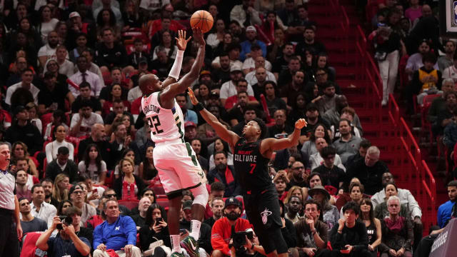 Milwaukee Bucks forward Khris Middleton (22) shoots over Miami Heat guard Kyle Lowry (7) 
